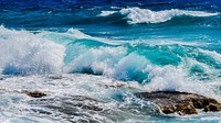 Deep blue and wavy sea view. Original public domain image from Wikimedia Commons