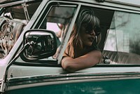 Boho woman road trip portrait in a minivan, travel HD photo