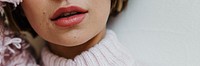 Portrait of a cheerful woman in a light pink sweater