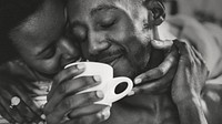 Black couple drinking coffee in the morning