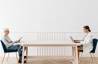 Social distancing, Women using a laptop across a woman who read a book