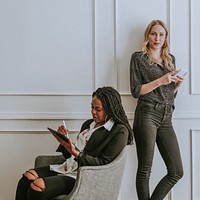 Diverse businesswomen using digital devices