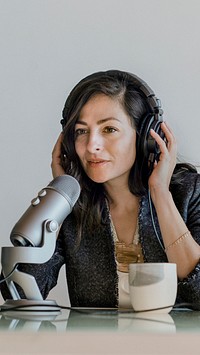 Female radio host broadcasting live in a studio