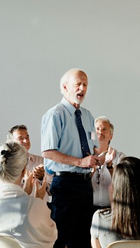 People sitting and talking with a group