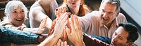 People joining hands in the air