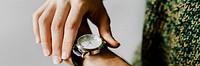 Closeup of a black watch on a wrist