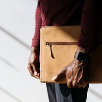 Man with a wristwatch holding a brown briefcase social template