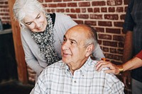 Happy elderly man on a wheelchair