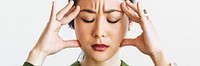 Stressed woman holding her forehead