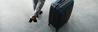 Woman and her luggage getting ready for a trip