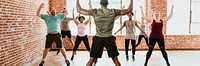 Trainer and his students stretching in a studio