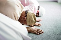 Muslim people praying in Sujud posture