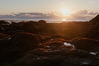 Beach sunset background with sea and rocks nature photography