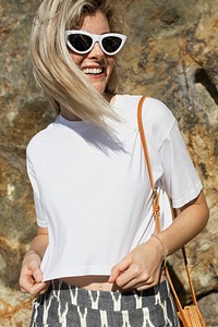 Blonde woman in white t-shirt summer fashion outdoor portrait