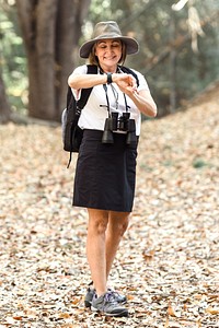 Senior woman looking at her wristwatch 