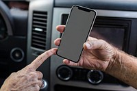 Grandpa showing his smartphone to grandma