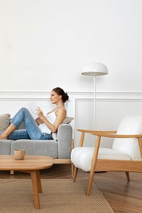 Woman reading a book in a minimal home