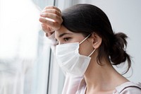 Woman wearing a face mask during at home