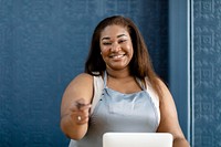 Small business owner at a cash register