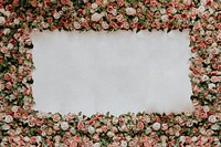 Sign mockup psd on a flower wall installation with blank space