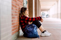 Bullied girl sitting alone at school