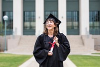 Girl graduating college, celebrating academic achievement 