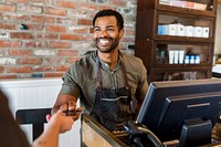 Receptionist taking payment for the customers