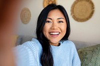 Woman saying hello, distance relationship through video call