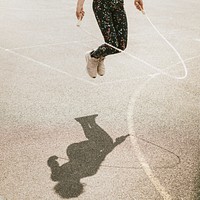 Young girl jumping rope, summer hobby