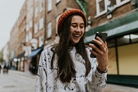 Woman having a video call in city