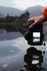 Snapping a shot of Kilchurn Castle reflected on Loch Awe, Scotland
