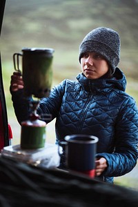 Woman preparing hot water for her morning coffee