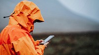 Woman using her mobile phone in the highlands