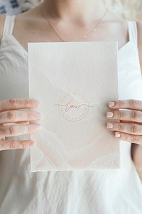 Bride holding a love white card