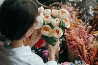 Woman picking up some Romantic Vuvuzela Roses