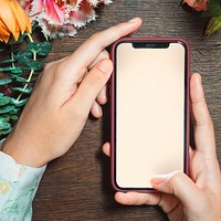 Woman holding a mobile screen mockup