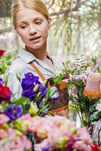 Florist by a bunch of flowers