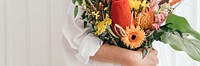 Woman holding a colorful tropical bouquet