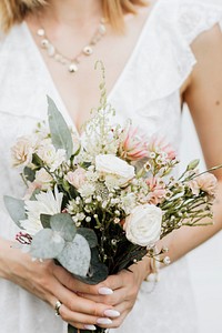 Closeup of a woman holding a  flower bouquet
