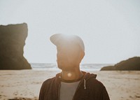 Guy walking on a sunny beach