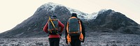 Hikers at Glen Coe valley in the Scottish Highlands