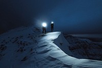 Mountaineers trekking in the cold night at Liathach Ridge, Scotland