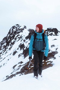 Backpacker hiking up Segla mountain, Norway