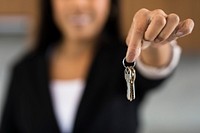 Property agent handing over keys