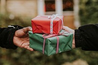 Friends exchanging gifts at a Christmas party 