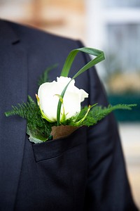 Groom wearing a boutonniere on his wedding day
