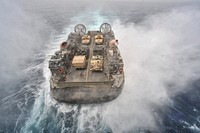 U.S. Navy Landing Craft, Air Cushion 67 approaches the well deck of the amphibious assault ship USS Bataan (LHD 5), not pictured, in the Arabian Sea April 6, 2014.