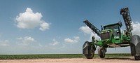 Josh Marek performs an operational check of a sprayer before heading to a local farm in Wharton County, TX on Jun. 20, 2013.