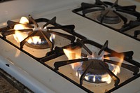 Yellow flame gas range. Original public domain image from Flickr