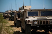 Humvee's from the New Jersey National Guard line the runway during a close air support exercise on day two of Operation Morning Coffee, a joint exercise with the New Jersey Army and Air National Guard, Maryland Air National Guard, and the Marine Corps Reserve on Warren Grove Gunnery Range, N.J., June 17, 2015.
